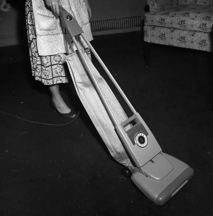 Framed Print : Woman Vacuuming Framed Print : Woman Vacuuming