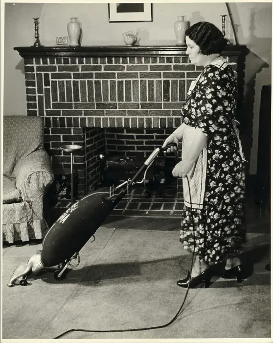 Framed Print : Woman Vacuuming Framed Print : Woman Vacuuming