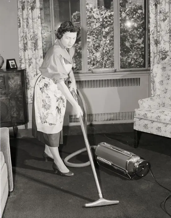 Framed Print : Woman Vacuuming Carpet Framed Print : Woman Vacuuming Carpet