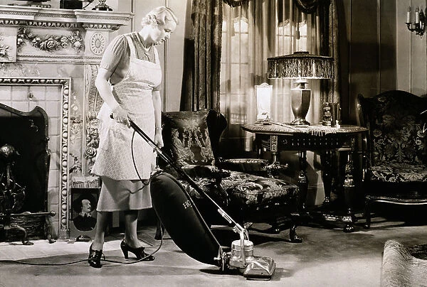 Woman Vacuuming Living Room in 1930S