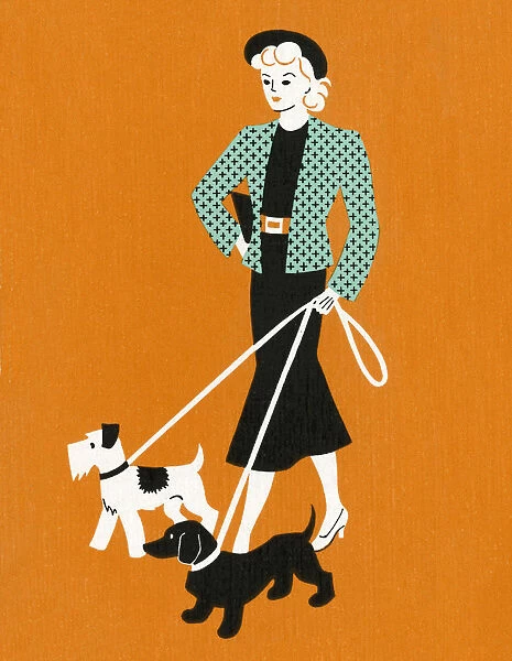 Woman Walking Two Dogs on Leashes