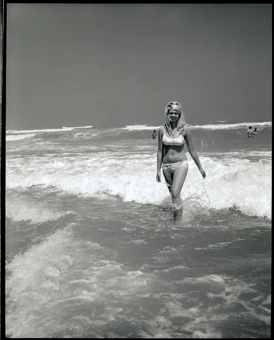 Framed Print : Woman Walks Out Of Ocean Surf Framed Print : Woman Walks Out Of Ocean Surf