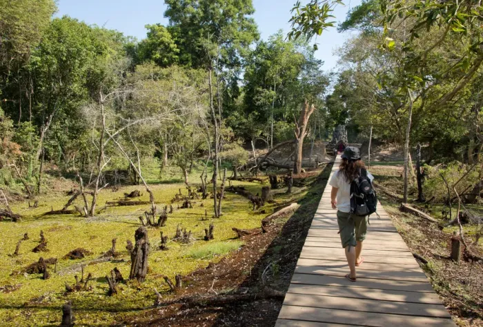 Framed Print : Woman on walkway at Neak Pean, Angkor, Cambodia Framed Print : Woman on walkway at Neak Pean, Angkor, Cambodia