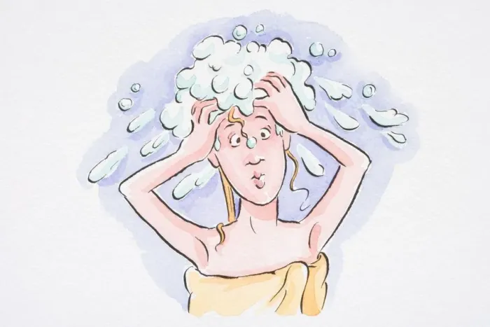 Framed Print : Woman washing her hair, with a towel wrapped around her body