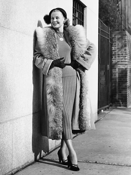 Woman wearing fur coat posing outdoors, (B&W), (Portrait)