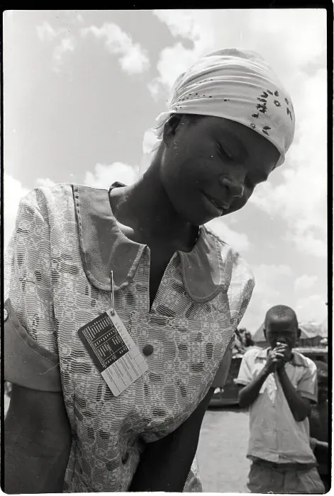 Framed Print : Woman Wearing I.D. Card to Fetch Water