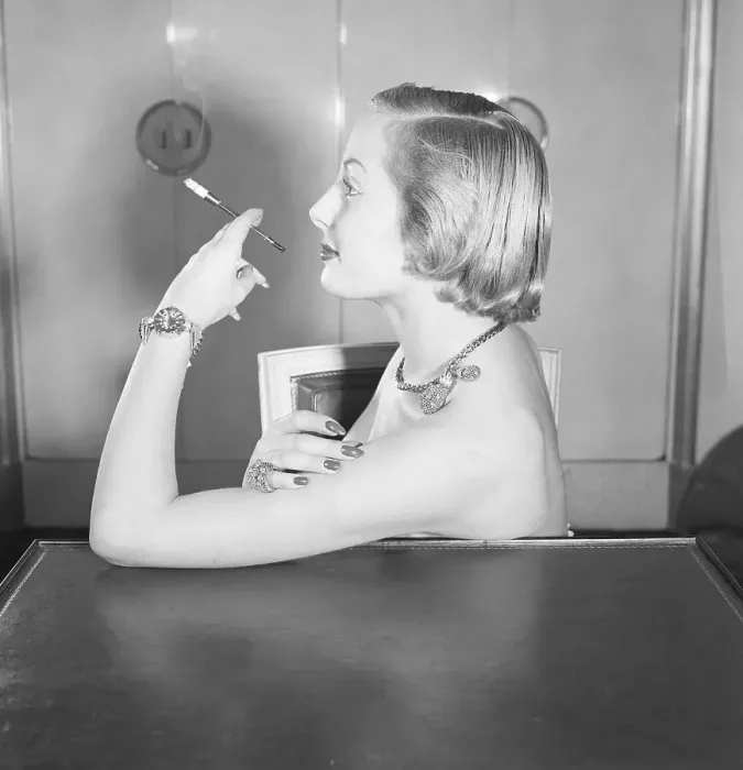 Framed Print : Woman Wearing Jewels and Smoking Framed Print : Woman Wearing Jewels and Smoking