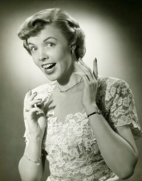 Woman wearing lace dress gesturing in studio, (B&W), (Close-up), (Portrait)
