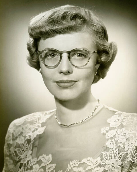 Woman wearing lace dress posing in studio, (B&W), (Close-up), (Portrait)