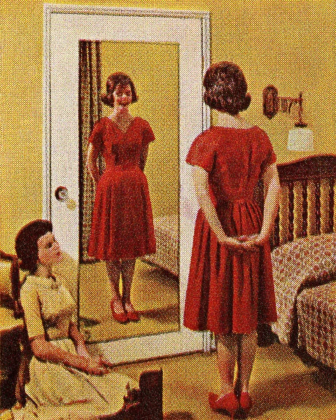 Woman Wearing Red Dress in Front of Mirror