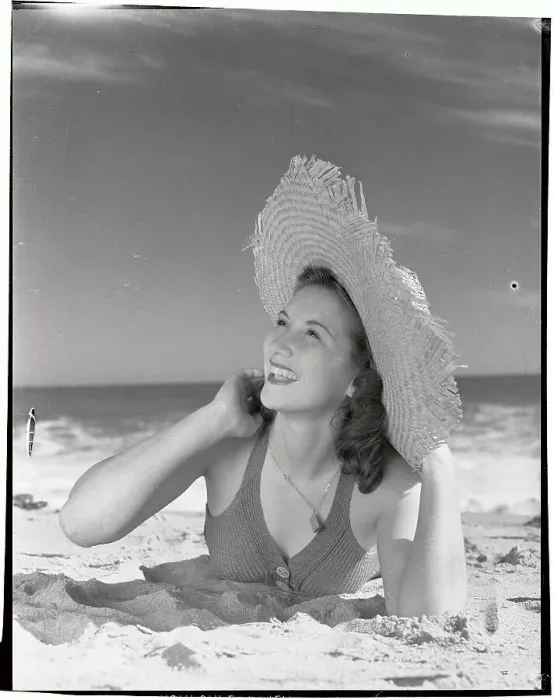 Framed Print : Woman Wearing Straw Hat Lying on Beach Framed Print : Woman Wearing Straw Hat Lying on Beach