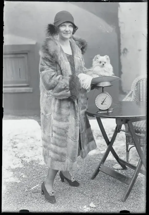 Framed Print : Woman Weighing Her Dog Framed Print : Woman Weighing Her Dog