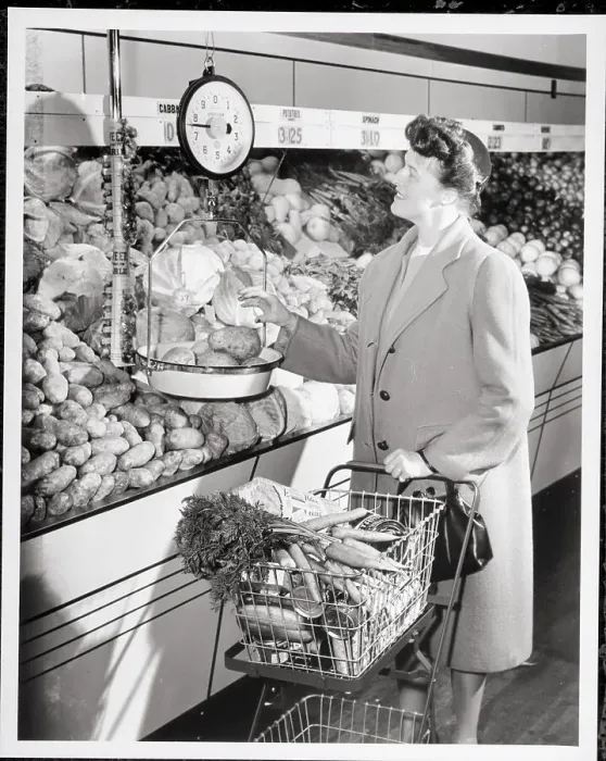 Framed Print : Woman Weighing Potatoes in Grocery Store Framed Print : Woman Weighing Potatoes in Grocery Store