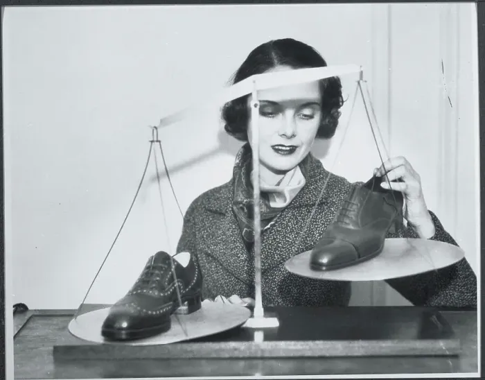 Framed Print : Woman Weighing Shoes on Scale Framed Print : Woman Weighing Shoes on Scale