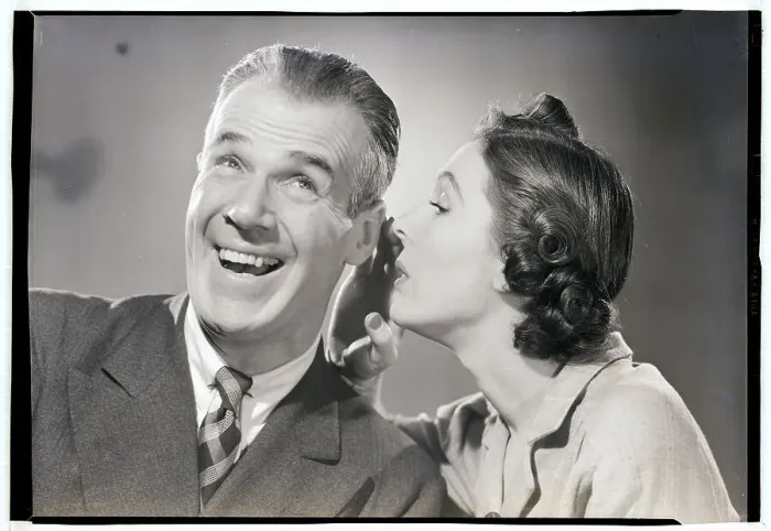 Framed Print : Woman Whispering in Man's Ear Framed Print : Woman Whispering in Man's Ear