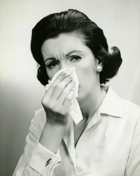 Framed Print : Woman wiping nose with handkerchief, (B&W), (Portrait) Framed Print : Woman wiping nose with handkerchief, (B&W), (Portrait)