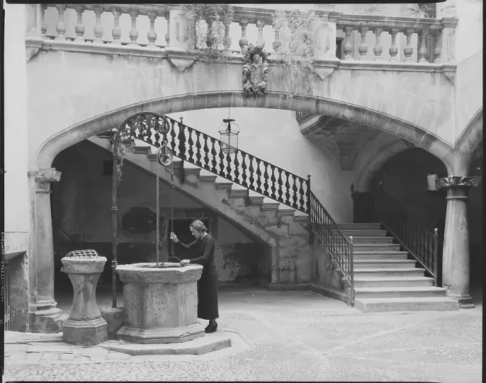 Framed Print : Woman Working in Courtyard