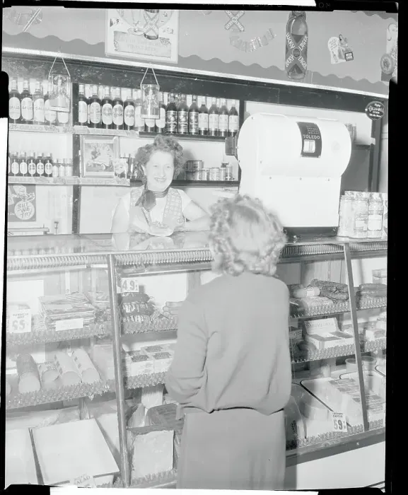 Framed Print : Woman Working at Delicatessen Framed Print : Woman Working at Delicatessen