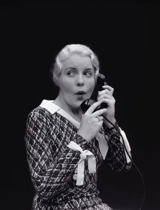 Framed Print : Woman with worried expression, on telephone. (Photo by H Framed Print : Woman with worried expression, on telephone. (Photo by H
