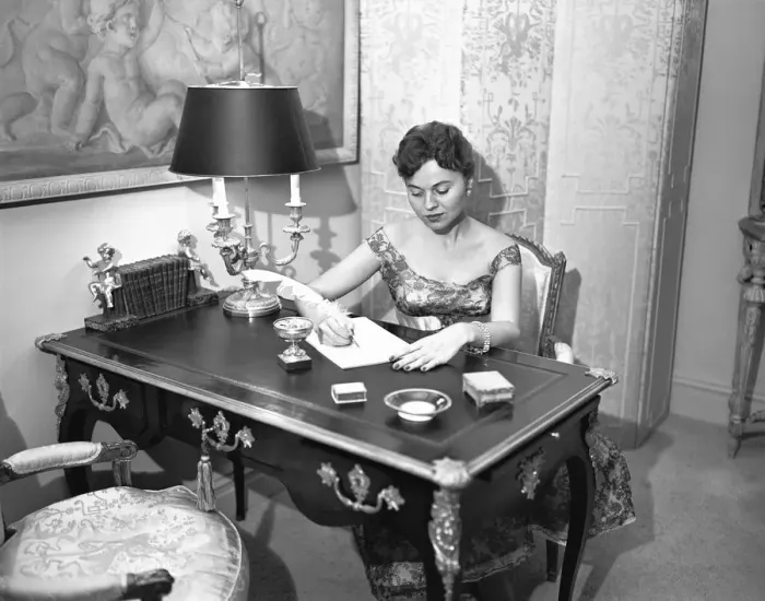 Framed Print : Woman writing at desk with quill pen, (B&W), elevated view Framed Print : Woman writing at desk with quill pen, (B&W), elevated view