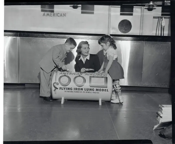 Framed Print : Woman and Youngsters Posing with Iron Lung Replica Framed Print : Woman and Youngsters Posing with Iron Lung Replica