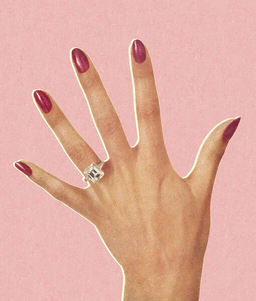 Womans Hand Wearing Engagement Ring