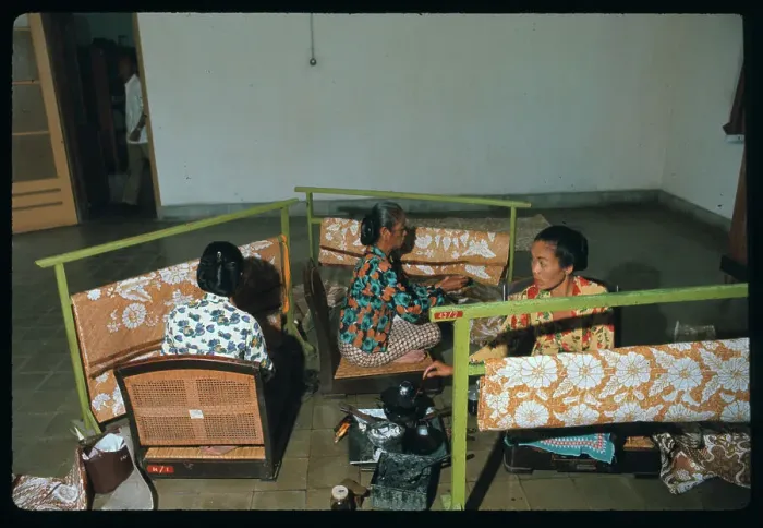 Framed Print : Women Applying Wax to Fabric Framed Print : Women Applying Wax to Fabric
