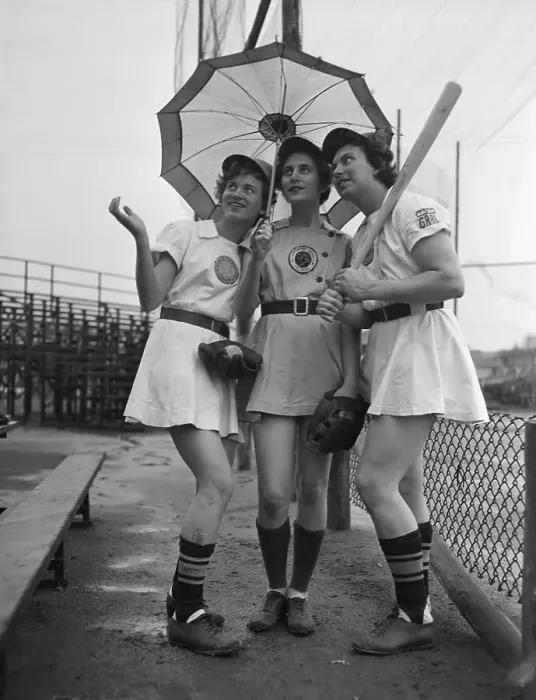 Framed Print : Women in Baseball Uniforms with Umbrella