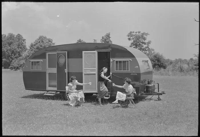 Framed Print : Women and Camping Trailer Framed Print : Women and Camping Trailer