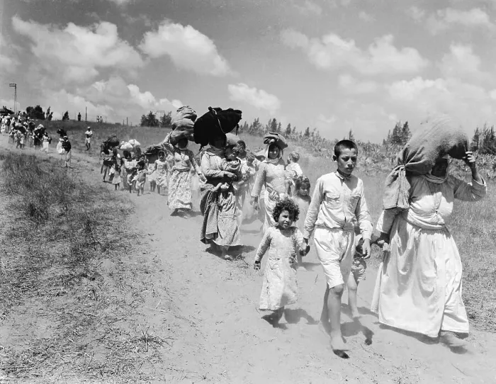 Framed Print : Women and Children Carrying Their Possessions Framed Print : Women and Children Carrying Their Possessions