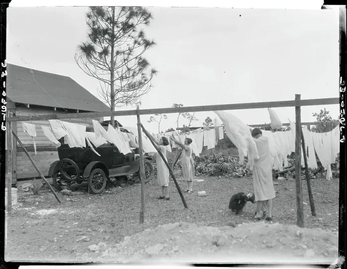 Framed Print : Women at Community Clothesline at Tourist Camp