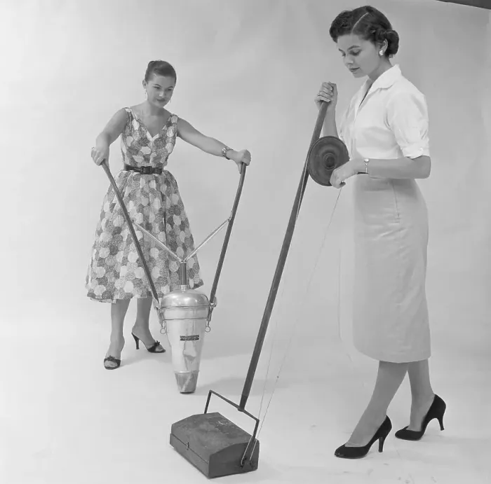 Framed Print : Women Demonstrate Old Vacuum Cleaners Framed Print : Women Demonstrate Old Vacuum Cleaners