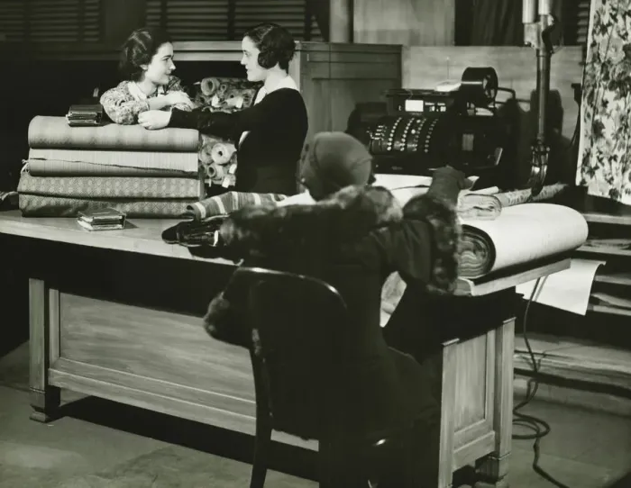 Framed Print : Three women in fabric shop, (B&W) Framed Print : Three women in fabric shop, (B&W)