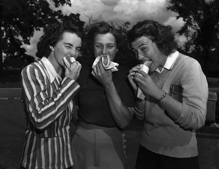 Framed Print : Women Golfers Eating Hot Dogs Framed Print : Women Golfers Eating Hot Dogs