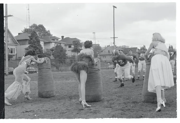 Framed Print : Women Helping a Football Team With Tackling Practice Framed Print : Women Helping a Football Team With Tackling Practice