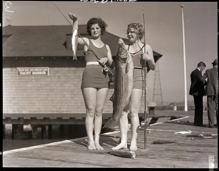 Framed Print : Women Holding Fish on Pier Framed Print : Women Holding Fish on Pier