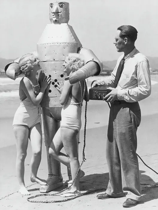 Framed Print : Women and Inventor with Robot at Beach Framed Print : Women and Inventor with Robot at Beach