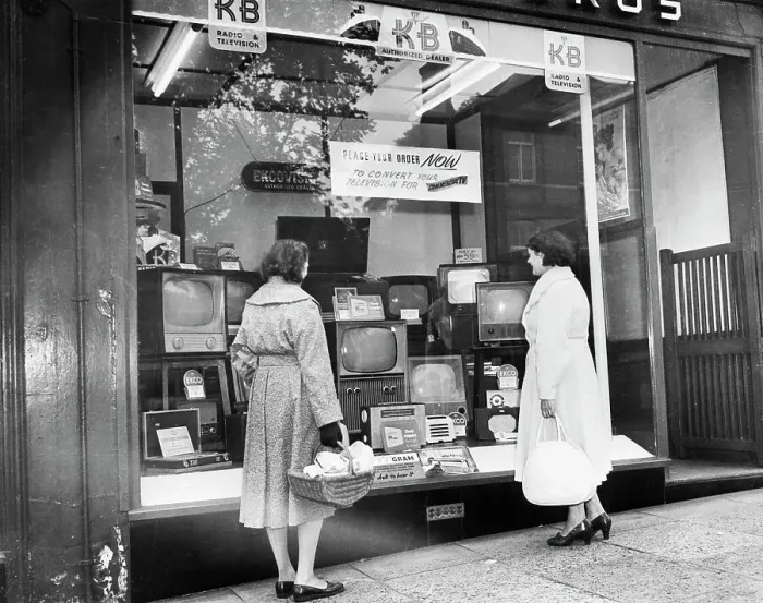 Framed Print : Women Looking at Televisions in Store Window Framed Print : Women Looking at Televisions in Store Window