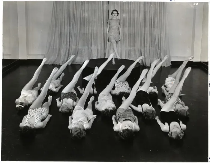 Framed Print : Women Lying In Rows Doing Leg Lifts Framed Print : Women Lying In Rows Doing Leg Lifts