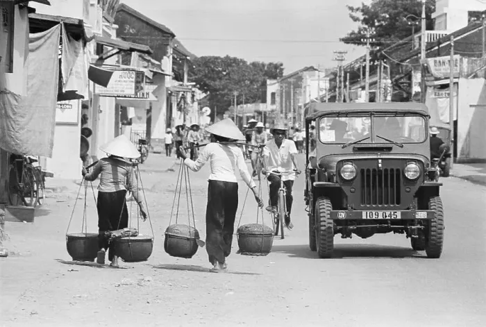 Framed Print : Women and Military Jeep in Saigon Framed Print : Women and Military Jeep in Saigon
