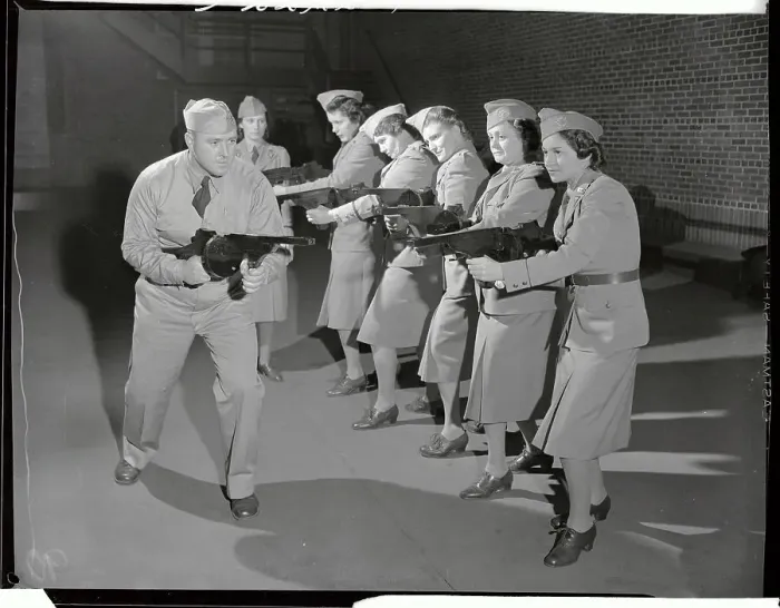 Framed Print : Women in Military Training with Weapons