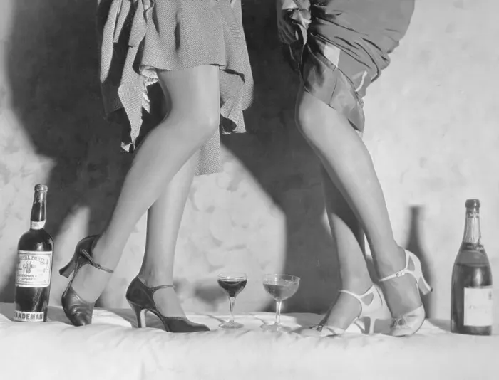Framed Print : Women Modeling Shoes near Wine Bottles Framed Print : Women Modeling Shoes near Wine Bottles