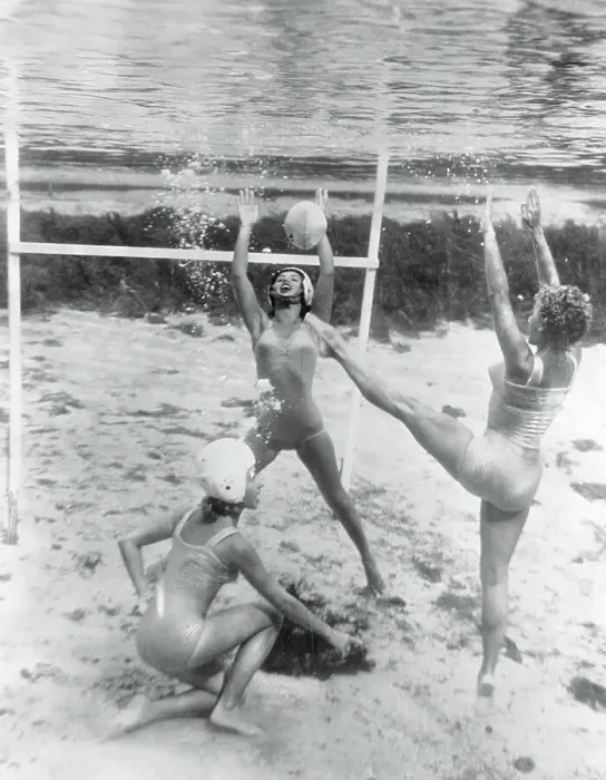 Framed Print : Women Playing a Game Underwater Framed Print : Women Playing a Game Underwater