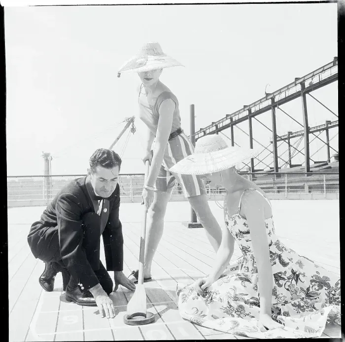 Framed Print : Women Playing Shuffleboard in Fashionable Straw Hats Framed Print : Women Playing Shuffleboard in Fashionable Straw Hats