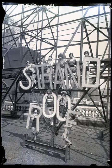 Framed Print : Women On Roof Hold Sign, Strand Roof Framed Print : Women On Roof Hold Sign, Strand Roof