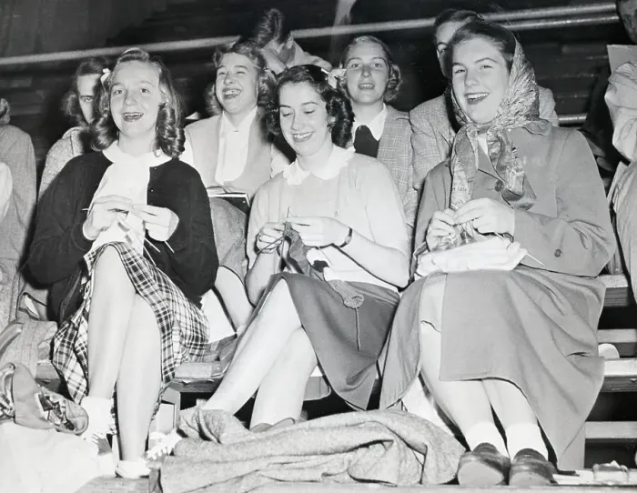 Framed Print : Women Seated in Stands Knitting Framed Print : Women Seated in Stands Knitting