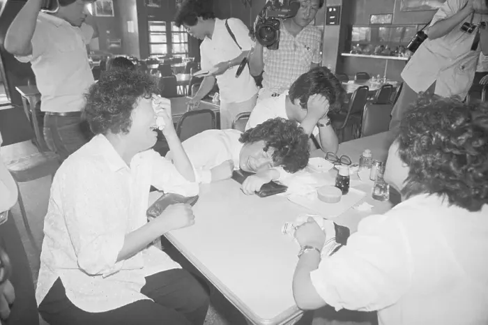 Framed Print : Women Seated At Table Crying