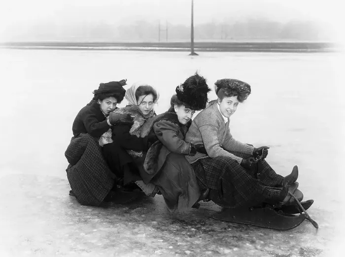 Framed Print : Four Women Seated On a Toboggan Framed Print : Four Women Seated On a Toboggan