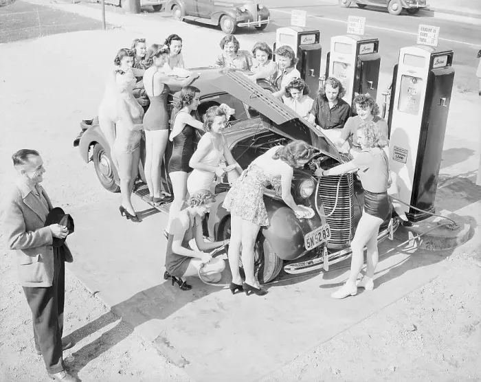 Framed Print : Women Servicing Car in Bathing Suits Framed Print : Women Servicing Car in Bathing Suits