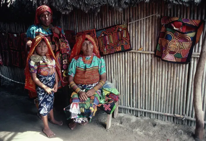 Framed Print : Three Women Sit Outside of Hut Framed Print : Three Women Sit Outside of Hut